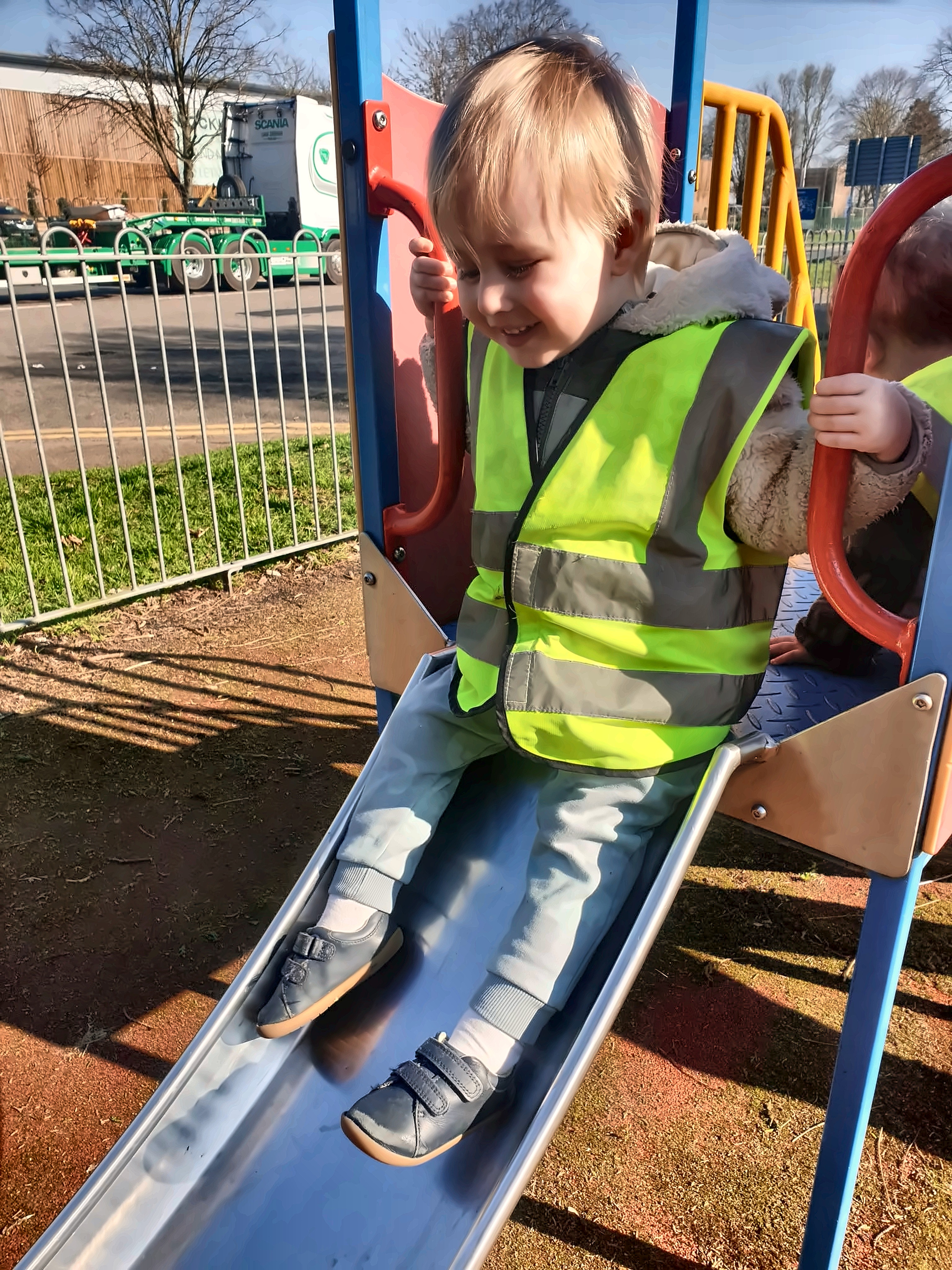 Children smiling and playing at Mucky Pups